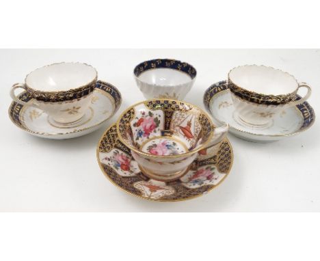 A 19th century English porcelain cup and saucer, the interior of the cup and saucer decorated with flowers and gilt lattice t