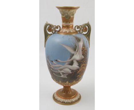 A Royal Worcester pedestal vase, the powder blue ground decorated to the front with five swans in flight, with rushes and gil