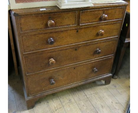 A 19th century oak chest of drawers, having cross banded decoration, fitted two short drawers over three long drawers, raised