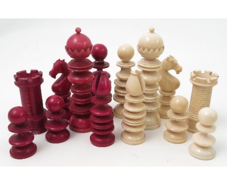 A 19th century ivory chess set, in natural and stained red, with turned pieces, thirty-two pieces, some af, height of king 3.