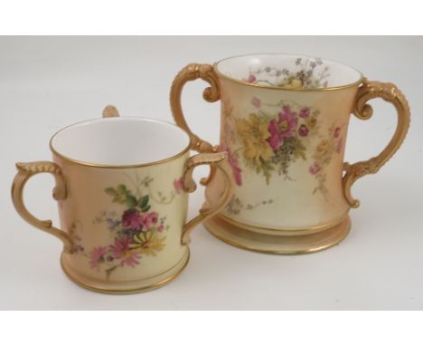 A Royal Worcester blush ivory two handled loving mug, decorated with floral sprays to the interior and exterior, af, height 6