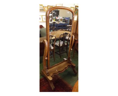 Victorian faded mahogany framed cheval mirror with arch plate set within two carved and scrolled supports, shaped front and r
