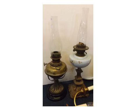 Victorian brass oil lamp with brass font on a circular black glass base, cast stand, together with a further cast square form