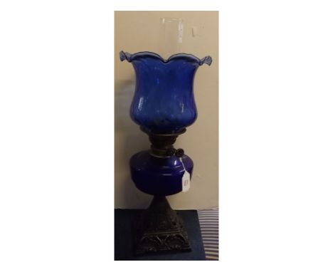 Victorian iron based oil lamp with blue font and matching crimped edge shade, 22ins high 