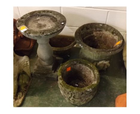 Group comprising two composition garden urns, 17ins diam and 12ins diam together with a pedestal bird bath, 14ins diam and a 