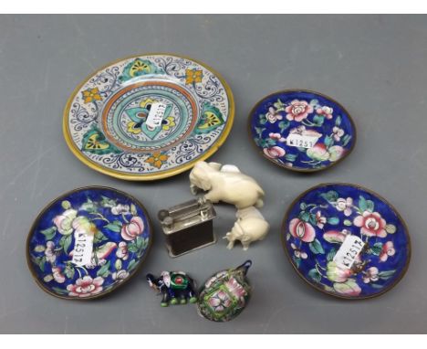Mixed group: two small early 20th century ivory model elephants together with two miniature enamelled elephants, together wit