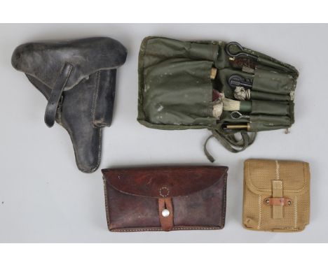 Leather hard cased pistol holster together with gun cleaning kit etc 