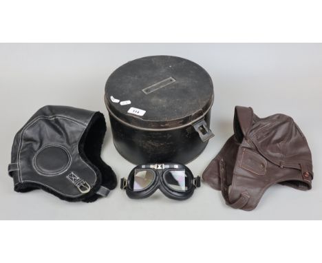 Black enamel military Hat box (tin) contents 2 aviator caps and a pair of goggles 
