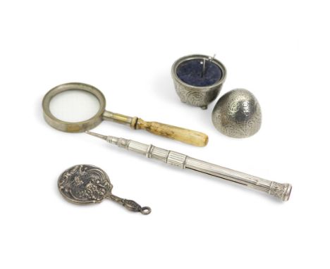 Pewter pin cushion in the form of an egg, by A.E. Williams, miniature Art Nouveau design hand mirror, white metal propelling 