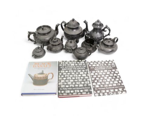 Early 19th century and later black basalt tea wares, mostly with relief or engine-turned bodies, including a large Cyples tea