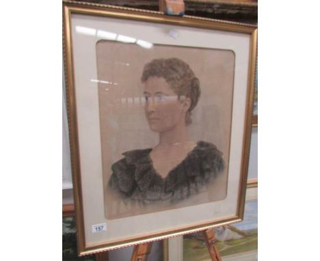 A framed and glazed portrait print of a lady