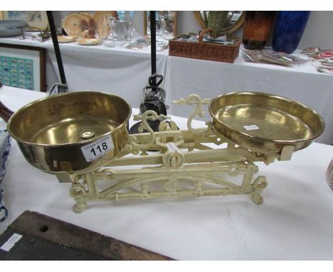 A set of old continental scales with brass pans and weights