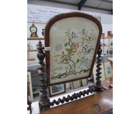 A mahogany toilet mirror inset with tapestry