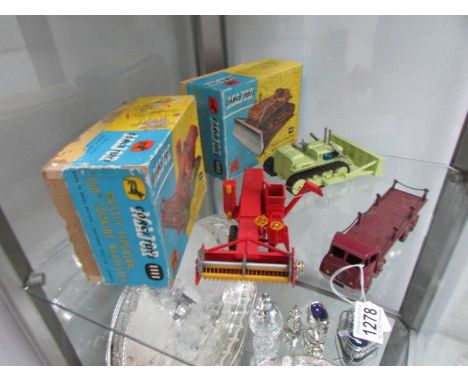 A boxed Corgi toys 1102 Euclid tractor with dozer blade, a boxed Corgi toys 1111 Massey-Ferguson combine harvester and an unb