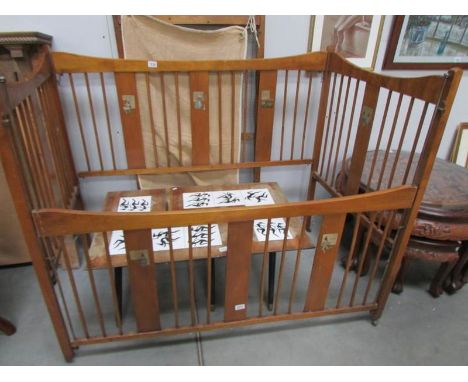 A vintage babies cot with transfers