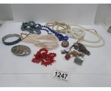 A mixed lot of costume jewellery including 'stick coral' necklace and glass necklace