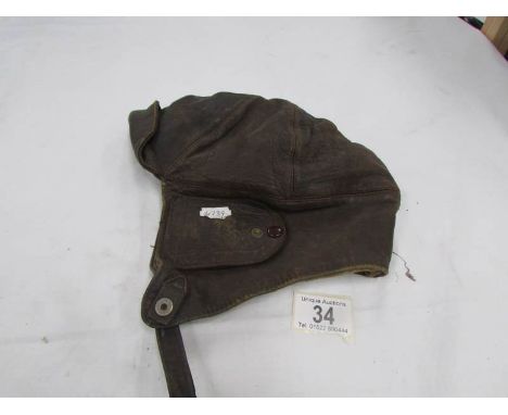 A vintage leather motorcycle helmet