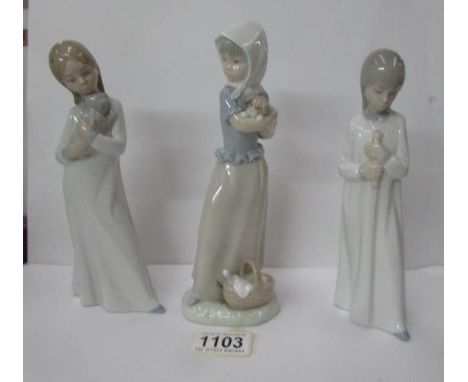 3 NAO figurines of girls holding animals