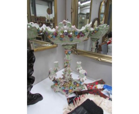 A continental porcelain candelabra/comport surmounted cherubs, a/f