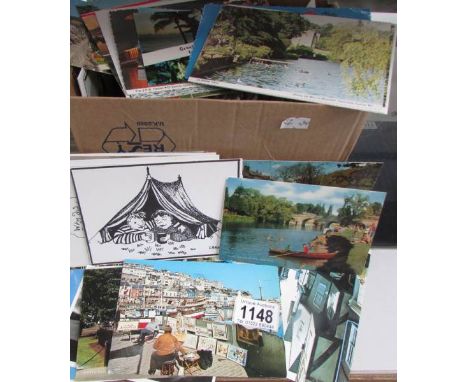 In excess of 250 postcards, humour, art, topographical etc