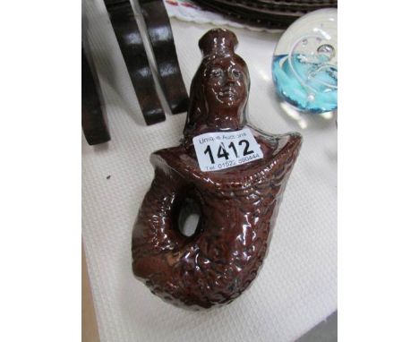 A late 19th century salt glaze decanter as a mermaid