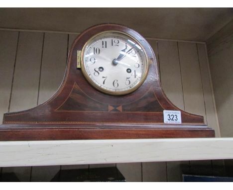An inlaid mantel clock