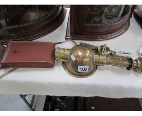 A brass compass, a brass lamp with GWP plaque and a Kodak Junior II camera
