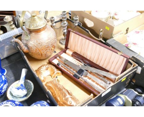 Cased carving set, two jelly moulds, large brass decorative teapot and small white metal candelabra  This bladed lot is not f
