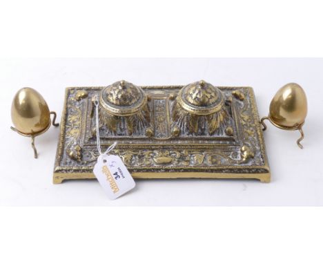 Brass desk top inkwell and pair of brass egg ornaments on stands
