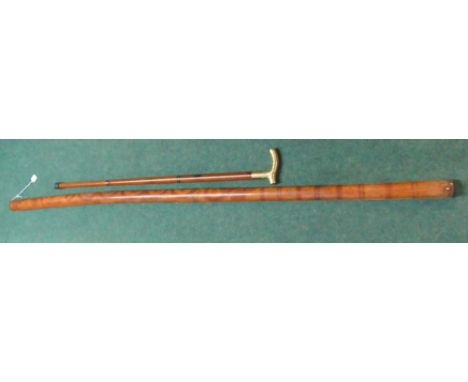 Native bamboo style wind instrument with inlaid detail and a brass top walking cane with internal glass tube (2) 