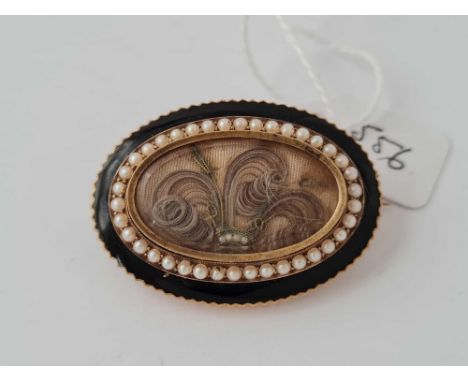 An antique 3.5cm long pearl and enamel locket brooch 12.9g inc