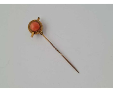 A gold antique garnet cabochon and coral stick pin