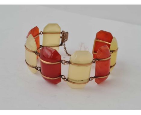 A hardstone and gilt metal panel bracelet