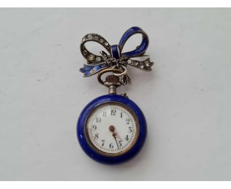 A ladies silver blue enamel lapel watch complete with paste and enamel silver bow slight cracking to face with pictured ename