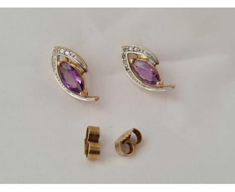 A pair of diamond and amethyst 9ct earrings 1.8g inc