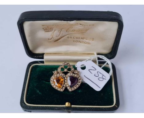 A EDWARDIAN VALENTINES DAY TWIN HEART AMETHYST AND CITRINE BROOCH SET IN GOLD BOXED 