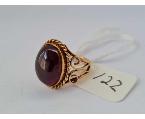 A cabochon garnet ring size F