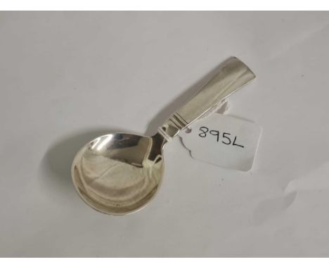 A Georg Jensen caddy spoon stamped sterling Denmark, 4" long