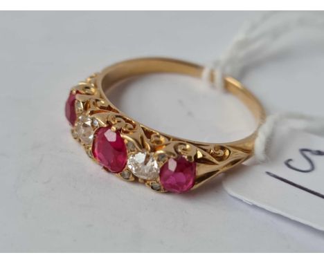A VICTORIAN RUBY AND DIAMOND RING  (DIAMONDS APPROX. 25 PTS EACH) 18CT GOLD SIZE P 1/2 - 4.2 GMS  