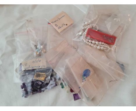 A large parcel of mixed gem stones including sapphires, amethyst, pastes, citrine, and pearl etc. 