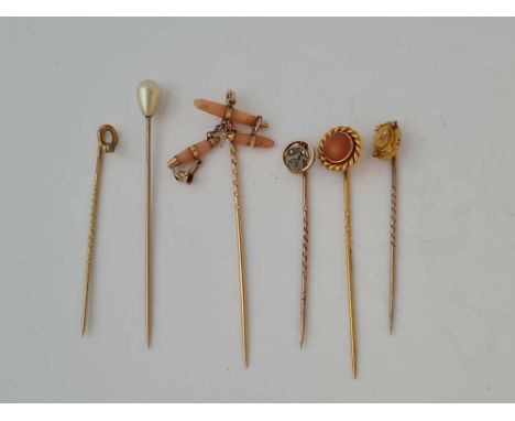 Assortment of six gold and other stick pins 