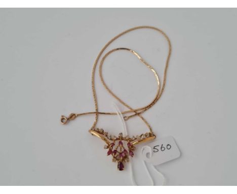 An 18ct gold ruby &amp; diamond pendant necklace 9.3g