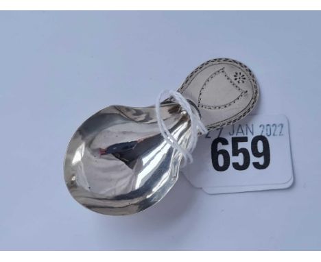 A early George III caddy spoon with bright cut edge and shield London 1784 