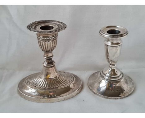 A oval adams style candle stick 1906 and another circular 