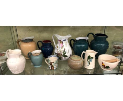 SHELF OF VARIOUS JUGS INCLUDING DENBY HARLEQUIN, DENBY LUXOR, PORTMEIRION AND OTHER JUGS