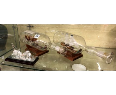 GLASS MODEL OF STEPHENSON'S ROCKET, A BLOWN SHIP IN A BOTTLE AND A CARRIAGE IN A BOTTLE MODELS