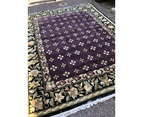 GOOD QUALITY CHINESE TYPE FLORAL CARPET WITH AN AUBERGINE CENTRAL GROUND WITHIN BLACK GROUND FLORAL BORDER 300CM X 238CM