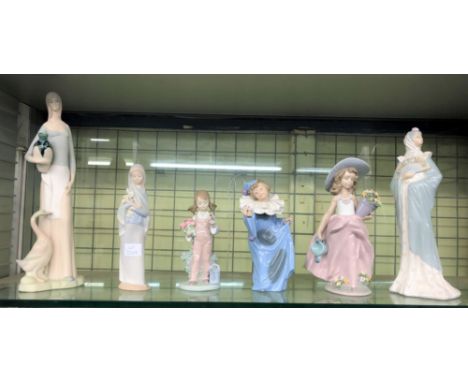 THREE LLADRO PORCELAIN FIGURES, TWO NAO FIGURES AND AN UNMARKED SIMILAR STYLE FEMALE FIGURE