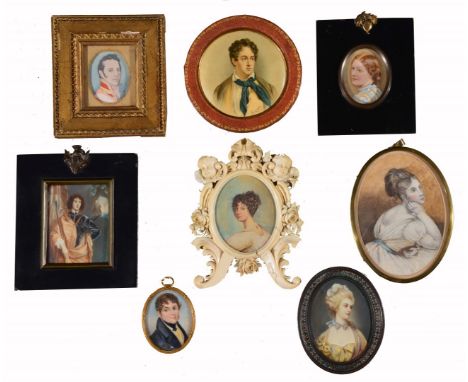 A 19TH CENTURY CARVED IVORY OVAL EASEL TYPE PORTRAIT MINIATURE FRAME carved with cherubs, flowers and scrolls, 16cm high, con