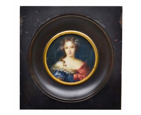 FRENCH SCHOOL (LATE 19TH CENTURY) A circular miniature portrait of a lady in flower trimmed blue dress and red shawl, waterco